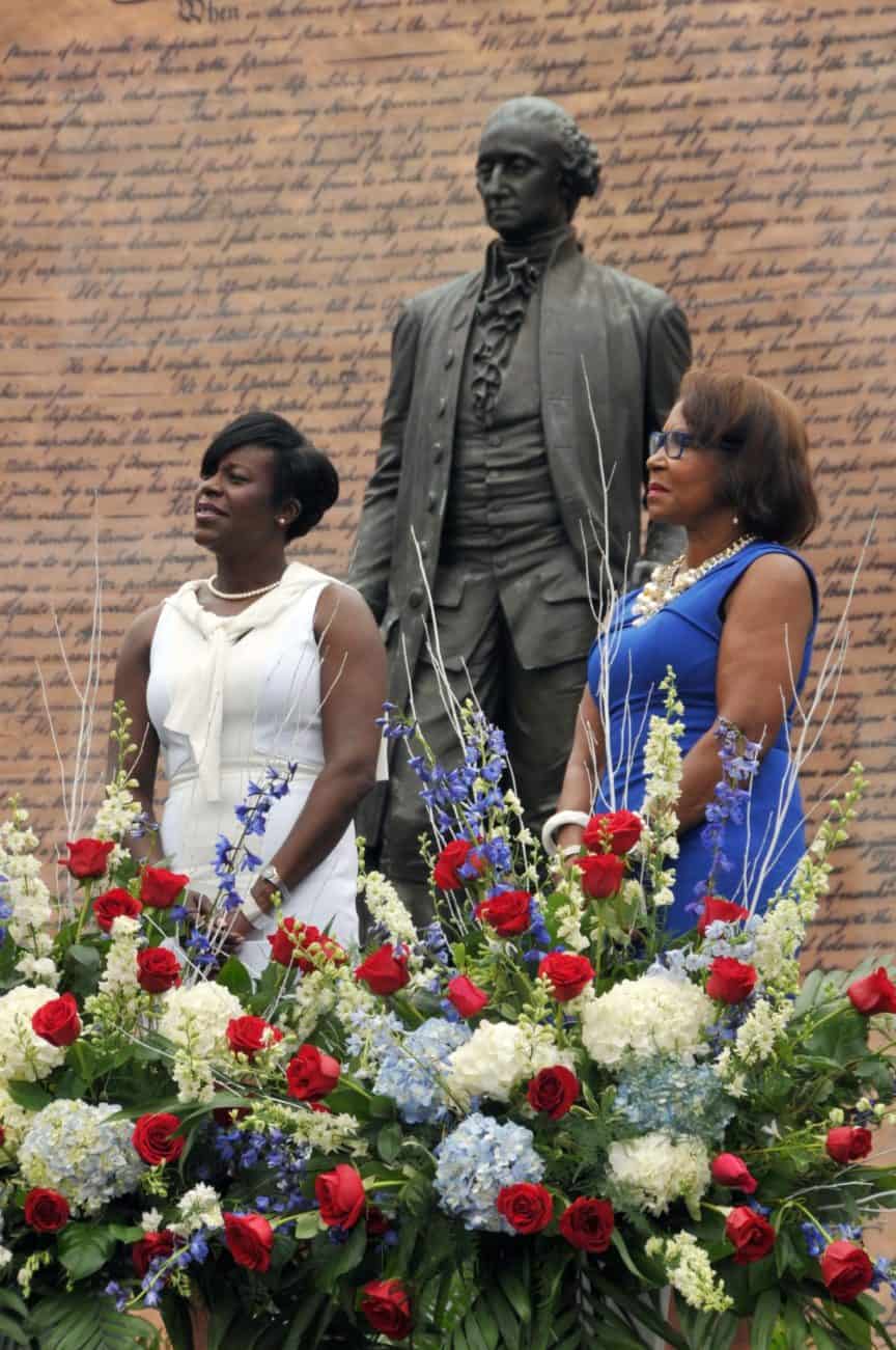 Councilmembers Cherelle Parker and Blondell Reynolds-Brown stand in front of statue of Thomas Jefferson.