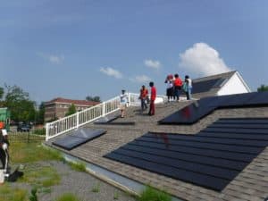 Class members on a practice roof at the Find Your Power solar trainee class