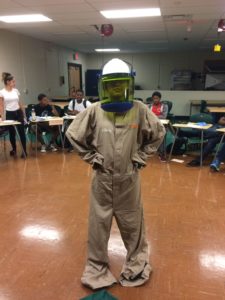 A youth dressed up in a uniform at the Find your Power solar trainee class