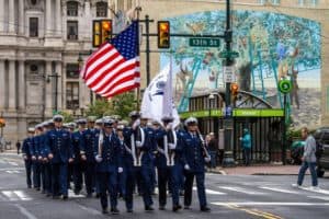 Coast Guardsmen march in the Veterans Day parade