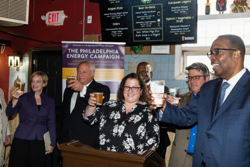 Council President Darrell Clarke and others make a toast with sustainability advocates and local business owners at Grey Lodge Pub