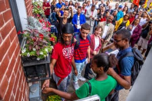 Group of students flip the switch at the Solarize Philly Installation
