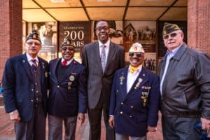 Council president Darrell Clarke stands with a group of senior veterans