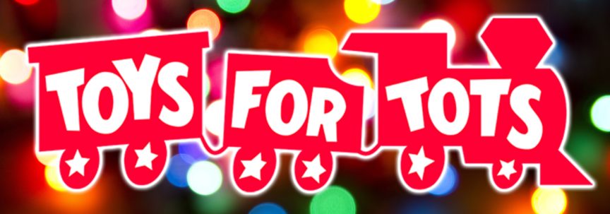 Toys for Tots logo with colored lights blurred in the background