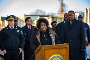 Council president Darrell Clarke and other city officials, outside near a dumping site, address the city's initiative to install 15 surveillance cameras to stop illegal dumping.