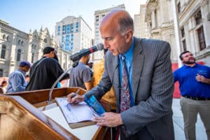 Councilman Mark Squilla writing on a clipboard