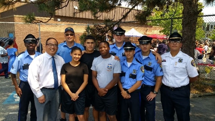 Councilman David Oh with Police officers and youth